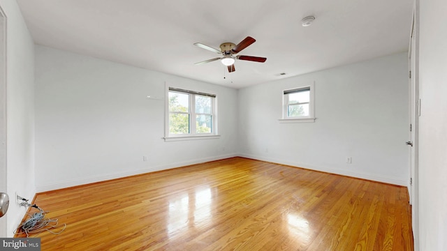 225 Dupont Cir, Wilmington, DE 19809 - empty room with plenty of natural light, a ceiling fan, and light wood-style floors