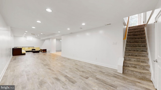 225 Dupont Cir, Wilmington, DE 19809 - basement with recessed lighting, stairs, light wood finished floors, and plenty of natural light