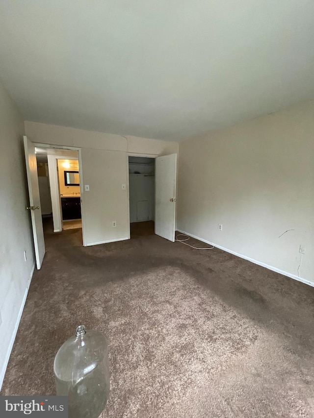 8477 Greenbelt Rd Unit 202, Greenbelt, MD 20770 - unfurnished bedroom with baseboards and carpet