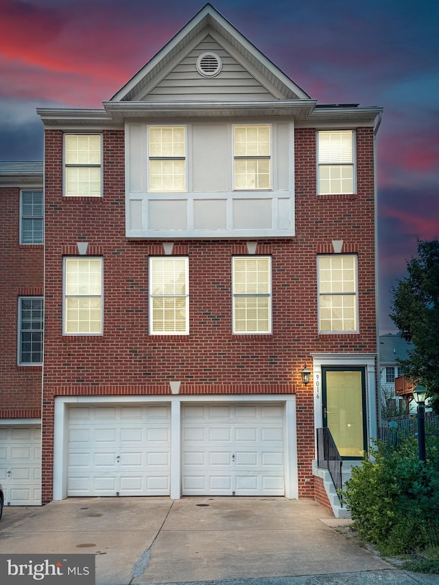 9016 Brewer Creek Pl, Manassas, VA 20109 - multi unit property featuring a garage, driveway, and brick siding