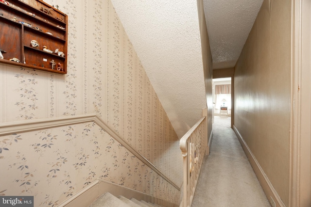 134 S 5th Ave, Royersford, PA 19468 - stairway with a textured ceiling, carpet flooring, and wallpapered walls
