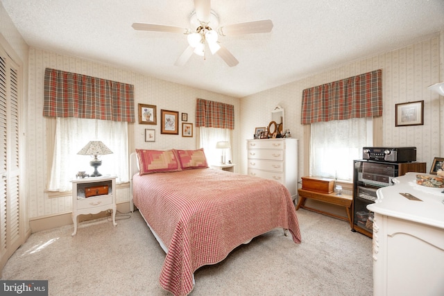 134 S 5th Ave, Royersford, PA 19468 - bedroom with wallpapered walls, light colored carpet, a textured ceiling, and ceiling fan