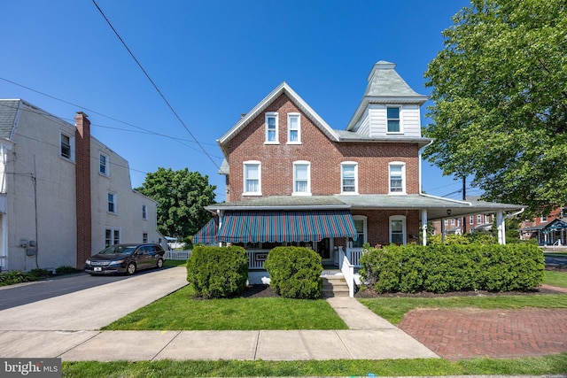 134 S 5th Ave, Royersford, PA 19468 - townhome / multi-family property featuring a porch and brick siding