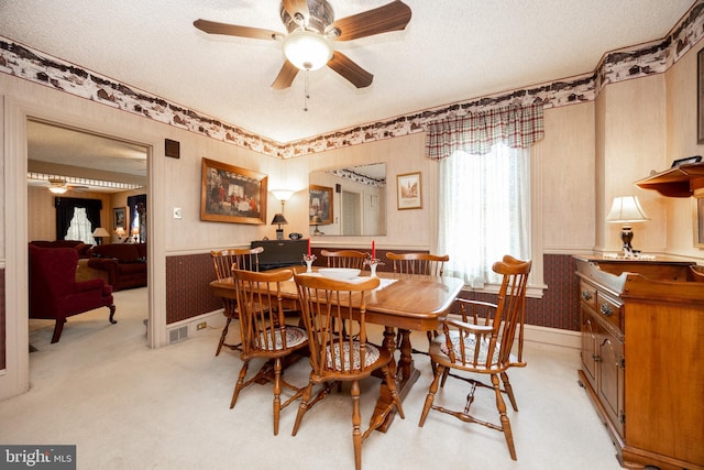 134 S 5th Ave, Royersford, PA 19468 - dining room featuring wallpapered walls, ceiling fan, a textured ceiling, light colored carpet, and baseboards