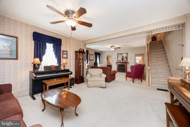 134 S 5th Ave, Royersford, PA 19468 - living area featuring wallpapered walls, a ceiling fan, carpet floors, and stairway