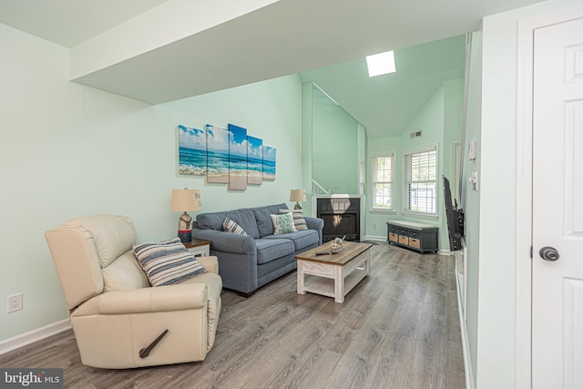 104 120th St Unit D82, Ocean City, MD 21842 - living area with wood finished floors, baseboards, and lofted ceiling