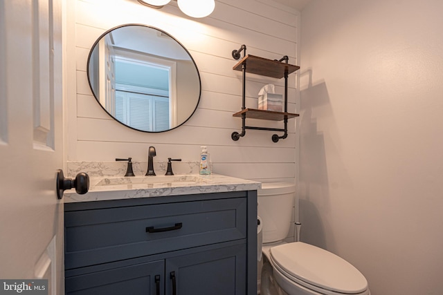 104 120th St Unit D82, Ocean City, MD 21842 - half bath featuring toilet, vanity, and wooden walls