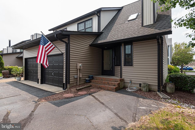 104 120th St Unit D82, Ocean City, MD 21842 - view of front of property with asphalt driveway, a garage, and a shingled roof
