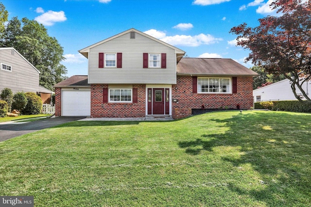 869 Primrose Dr, Warminster, PA 18974 - tri-level home with brick siding, an attached garage, driveway, and a front lawn