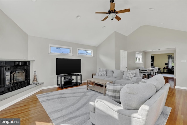 869 Primrose Dr, Warminster, PA 18974 - living room with ceiling fan, plenty of natural light, wood finished floors, high vaulted ceiling, and baseboards