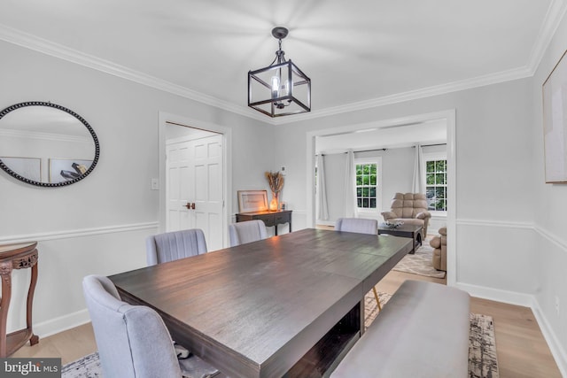 1606 Montmorency Dr, Vienna, VA 22182 - dining room featuring light wood-style flooring, crown molding, baseboards, and a chandelier