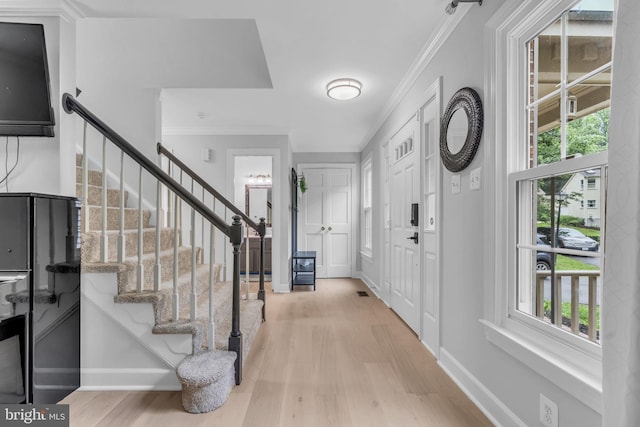 1606 Montmorency Dr, Vienna, VA 22182 - entrance foyer with stairs, light wood-style flooring, ornamental molding, and baseboards
