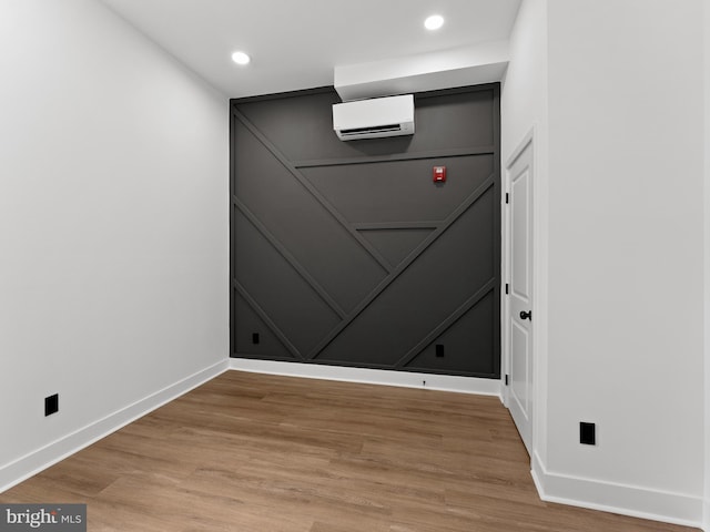 2331 N Front St, Philadelphia, PA 19133 - detailed view of baseboards, wood finished floors, a wall mounted air conditioner, and recessed lighting