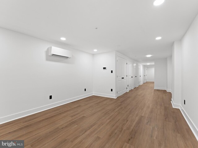 2331 N Front St, Philadelphia, PA 19133 - basement with an AC wall unit, recessed lighting, baseboards, and wood finished floors