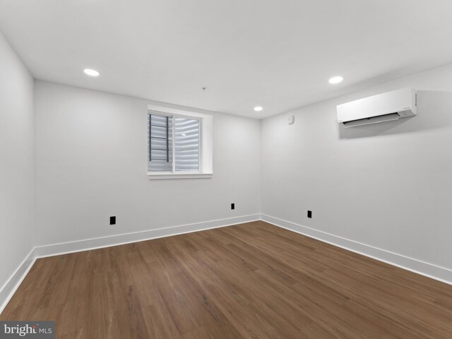 2331 N Front St, Philadelphia, PA 19133 - below grade area with a wall mounted AC, baseboards, dark wood-style flooring, and recessed lighting
