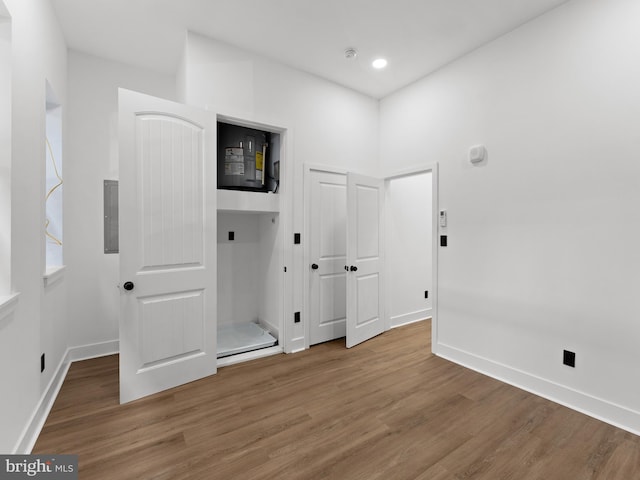 2331 N Front St, Philadelphia, PA 19133 - unfurnished bedroom featuring wood finished floors, baseboards, electric panel, and recessed lighting