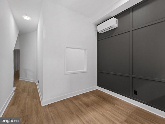 2331 N Front St, Philadelphia, PA 19133 - hall featuring a wall unit AC, light wood-style flooring, and baseboards