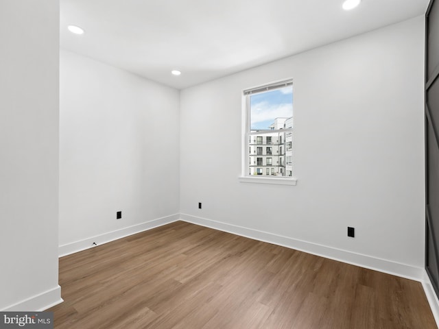 2331 N Front St, Philadelphia, PA 19133 - empty room with wood finished floors, recessed lighting, and baseboards