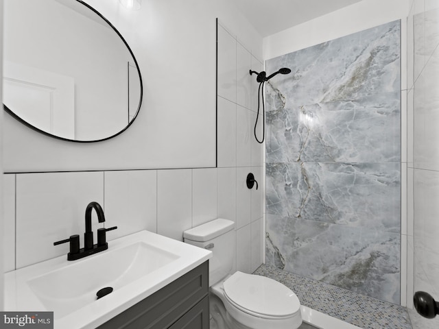 2331 N Front St, Philadelphia, PA 19133 - bathroom with tile walls, a tile shower, toilet, and vanity