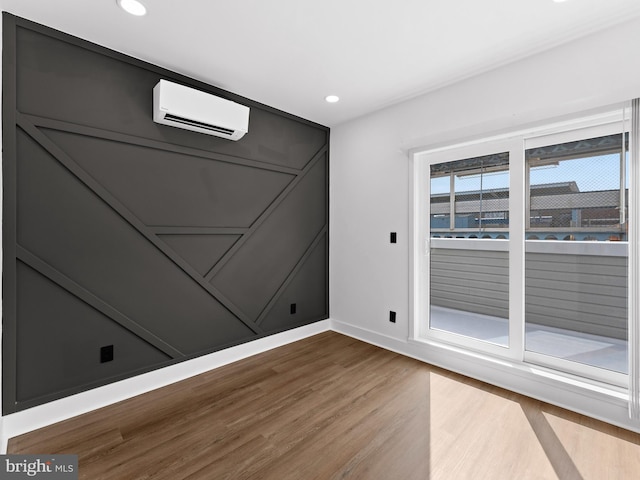 2331 N Front St, Philadelphia, PA 19133 - spare room featuring a wall mounted AC, wood finished floors, baseboards, and recessed lighting