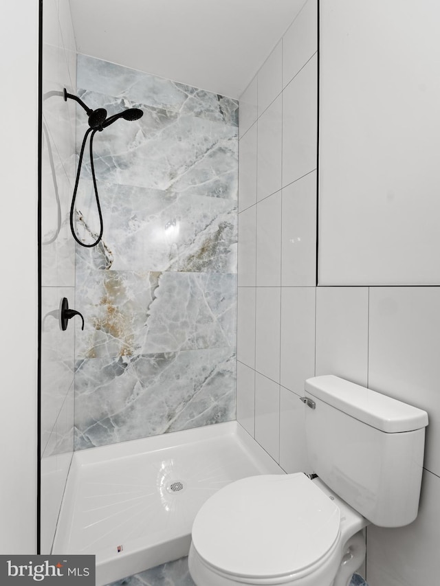 2331 N Front St, Philadelphia, PA 19133 - bathroom with tile walls, a stall shower, and toilet