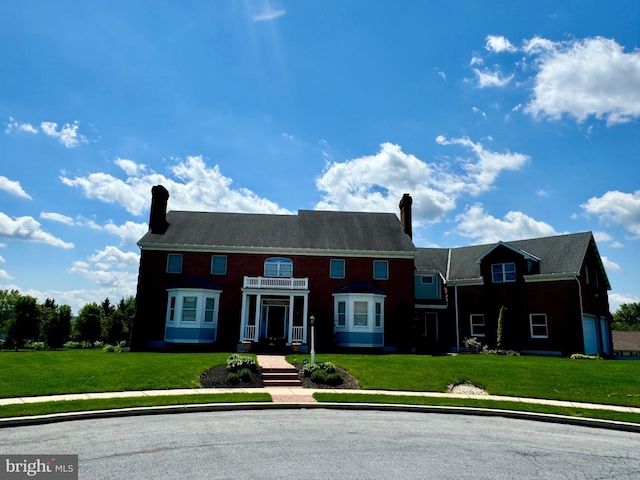 324 W Orchard Dr, Palmyra, PA 17078 - view of front of home featuring a chimney and a front yard