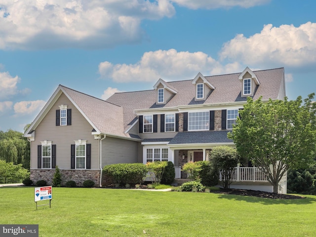 125 Candlewyck Dr, Avondale, PA 19311 - view of front facade featuring stone siding, a front lawn, and roof with shingles