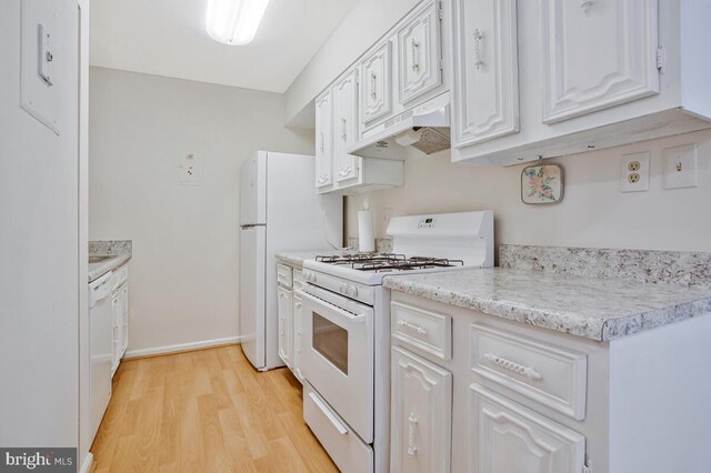 9 Silverwood Cir Unit 6, Annapolis, MD 21403 - kitchen featuring white appliances, under cabinet range hood, light wood-style floors, light countertops, and white cabinetry