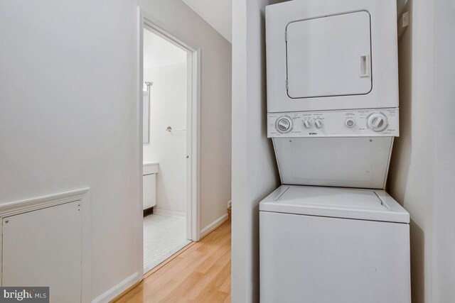 9 Silverwood Cir Unit 6, Annapolis, MD 21403 - washroom featuring stacked washer / dryer, wood finished floors, and baseboards