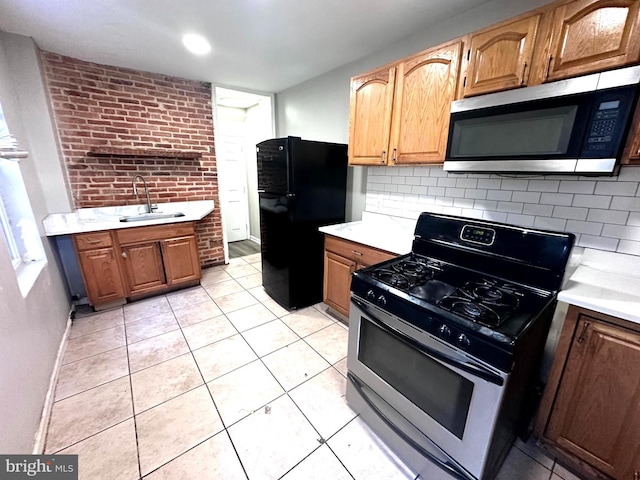 233 S Gilmor St, Baltimore, MD 21223 - kitchen with appliances with stainless steel finishes, a sink, light countertops, backsplash, and open shelves