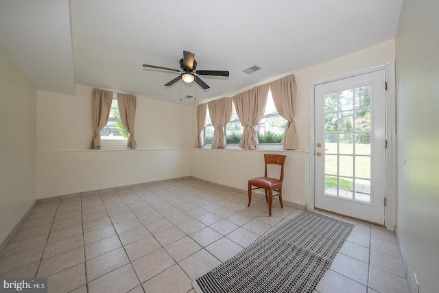 405 Garden Ln, Aston, PA 19014 - interior space featuring light tile patterned floors, ceiling fan, and baseboards