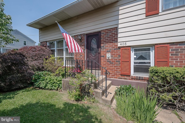 405 Garden Ln, Aston, PA 19014 - entrance to property featuring brick siding and a lawn