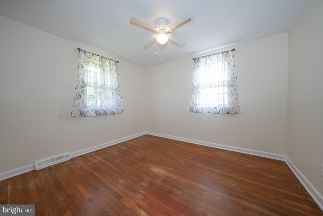 405 Garden Ln, Aston, PA 19014 - empty room with healthy amount of natural light, a ceiling fan, hardwood / wood-style flooring, and baseboards