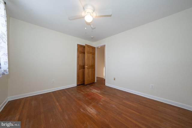 405 Garden Ln, Aston, PA 19014 - unfurnished bedroom with baseboards, dark wood-type flooring, and ceiling fan