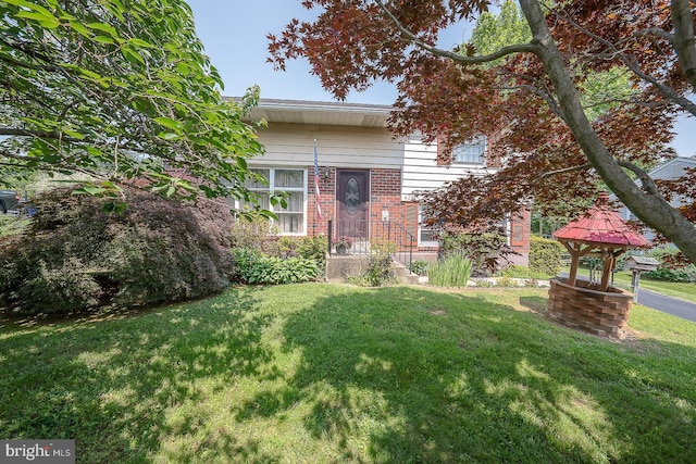 405 Garden Ln, Aston, PA 19014 - view of front of house featuring a front lawn and brick siding