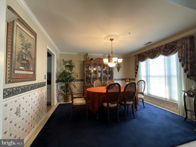 7324 Summerwind Cir, Laurel, MD 20707 - carpeted dining area featuring ornamental molding, a chandelier, and wainscoting