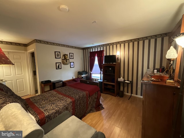 7324 Summerwind Cir, Laurel, MD 20707 - bedroom featuring wood finished floors and wallpapered walls
