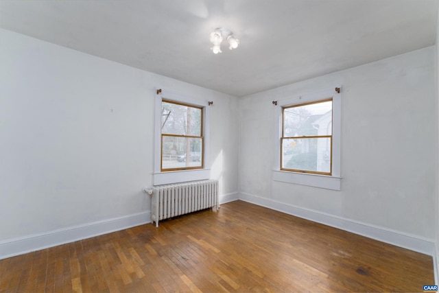 1316 Chesapeake St, Charlottesville, VA 22902 - unfurnished room with radiator heating unit, wood-type flooring, and baseboards