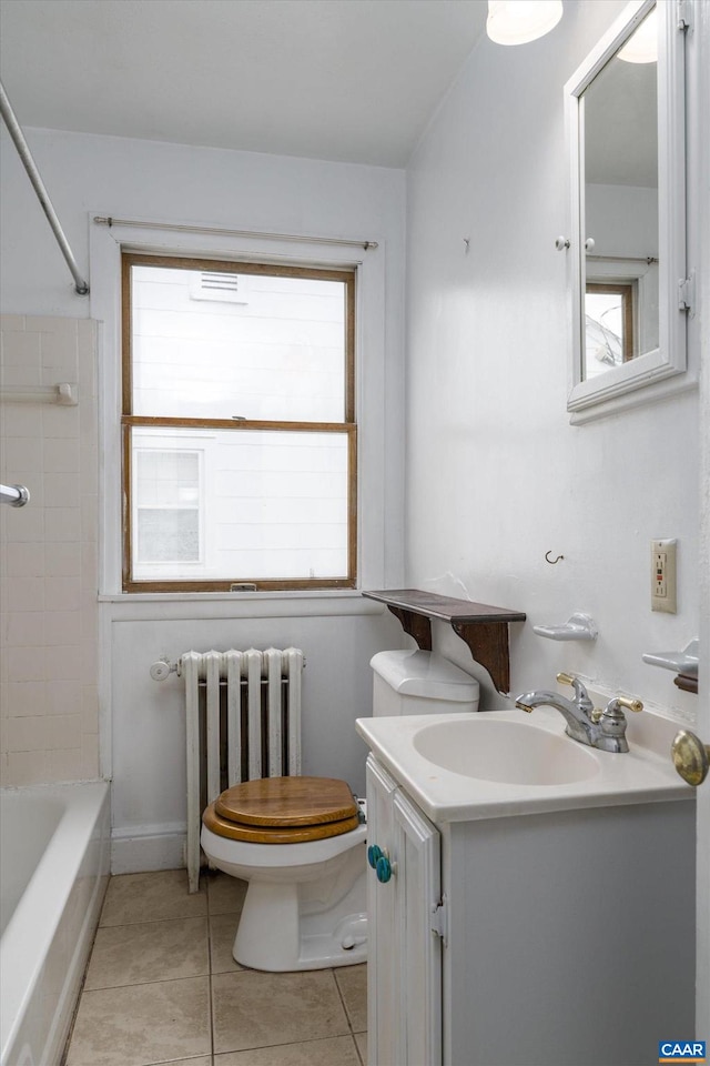 1316 Chesapeake St, Charlottesville, VA 22902 - bathroom featuring radiator heating unit, plenty of natural light, toilet, and vanity