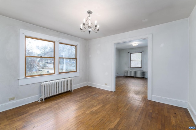 1316 Chesapeake St, Charlottesville, VA 22902 - empty room with radiator heating unit, a chandelier, and hardwood / wood-style flooring
