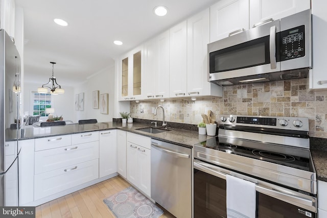 4377 Cherry Hill Rd, Arlington, VA 22207 - kitchen with stainless steel appliances, white cabinets, tasteful backsplash, light wood-type flooring, and recessed lighting