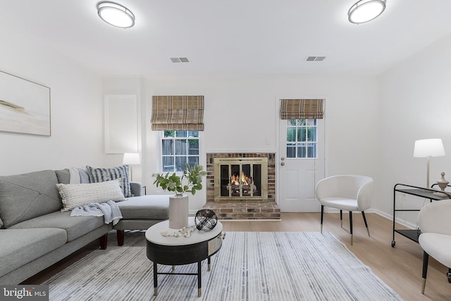 4377 Cherry Hill Rd, Arlington, VA 22207 - living area featuring wood finished floors and a brick fireplace