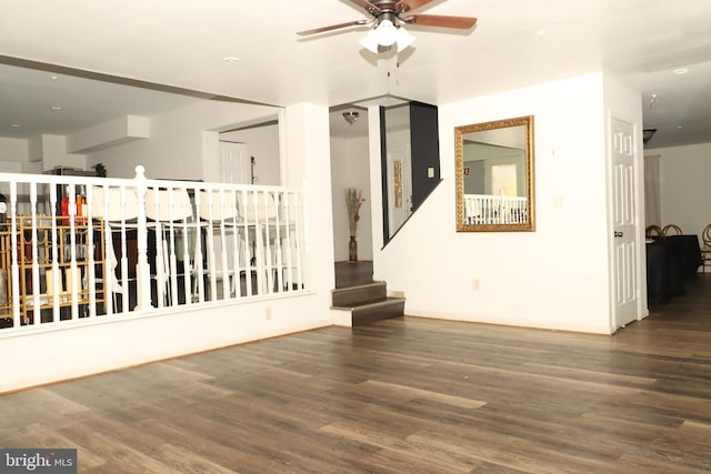 9216 Crandall Rd, Lanham, MD 20706 - unfurnished room featuring a ceiling fan, wood finished floors, and stairway