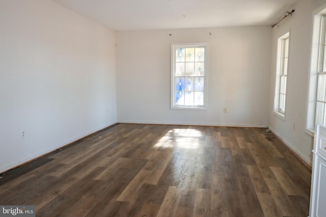 9216 Crandall Rd, Lanham, MD 20706 - empty room with dark wood-style flooring and baseboards