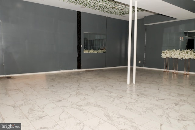 9216 Crandall Rd, Lanham, MD 20706 - empty room featuring marble look tiles and baseboards