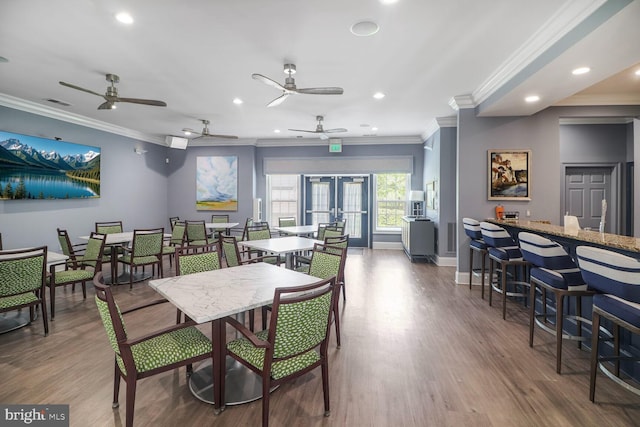 8612 Wintergreen Ct Unit 403, Odenton, MD 21113 - dining room featuring crown molding, ceiling fan, recessed lighting, baseboards, and wood finished floors