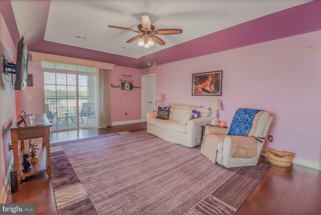 8612 Wintergreen Ct Unit 403, Odenton, MD 21113 - living area with a ceiling fan, wood finished floors, baseboards, and a tray ceiling