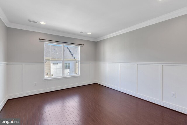 15713 Murphys Tin St, Silver Spring, MD 20906 - spare room featuring a decorative wall, wainscoting, dark wood finished floors, crown molding, and recessed lighting
