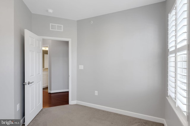 15713 Murphys Tin St, Silver Spring, MD 20906 - carpeted empty room with baseboards and a smoke detector