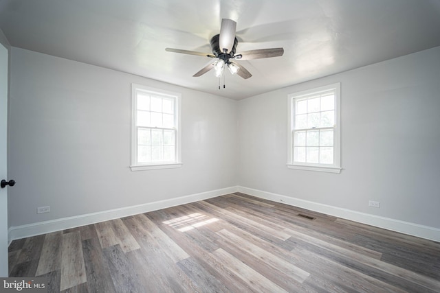 3232 N Rolling Rd, Baltimore, MD 21244 - empty room featuring healthy amount of natural light, wood finished floors, and a ceiling fan